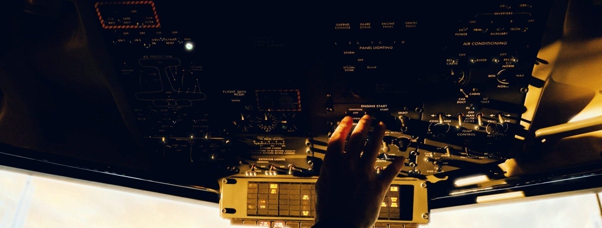 Pilots righthand on the upper controls in the cockpit